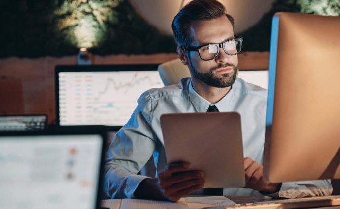 Man at the computer, doing quality assurance tests on Plumber Web Design